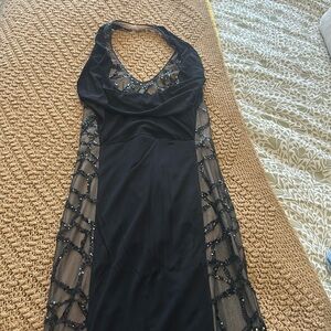 Woman’s formal gown. ABS Black And Cream Size Medium Not Hemmed.